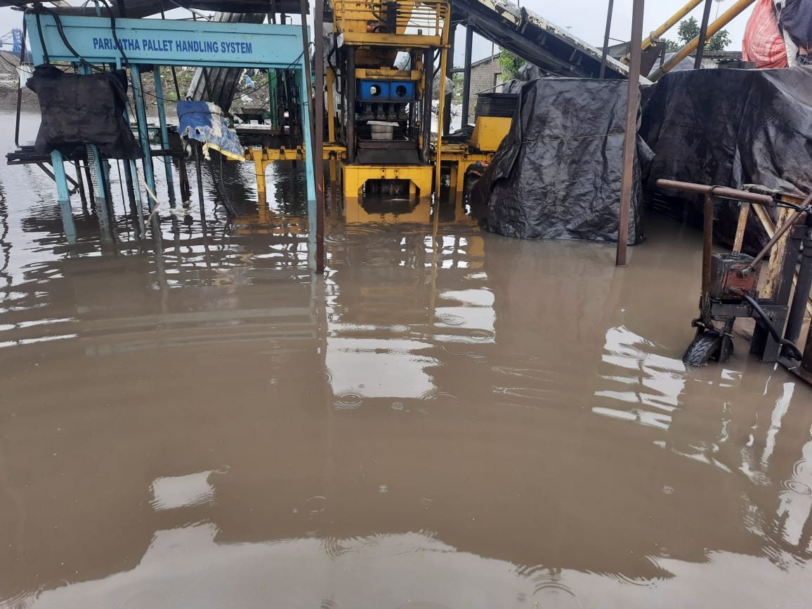 Block press and pallet handling system standing in monsoon floodwater at the Dhamra site plant