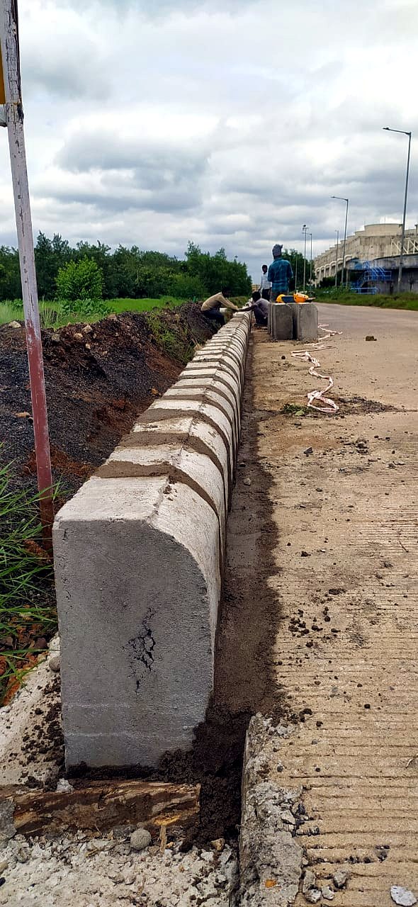 Precast kerbs fixed in a straight run along a plant road