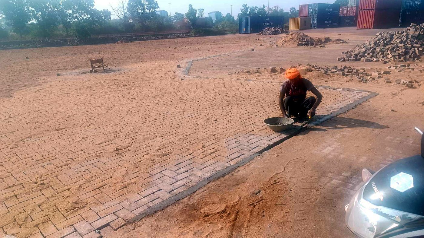 After re-laying at NMPA — jointing sand spread across the re-laid paver surface and brushed into the joints